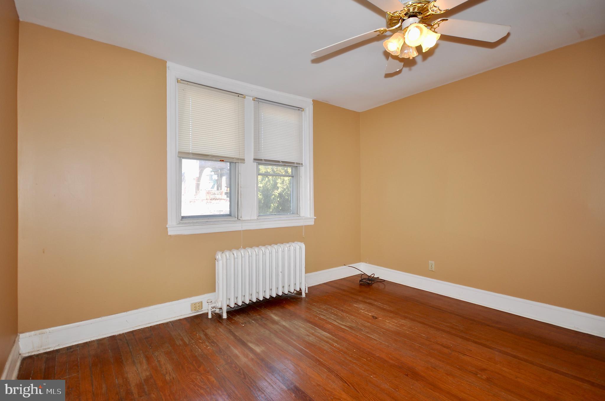 4566 Bermuda Street Philadelphia, PA 19124 - Photo 14 of 30 a view of an empty room with wooden floor and a window