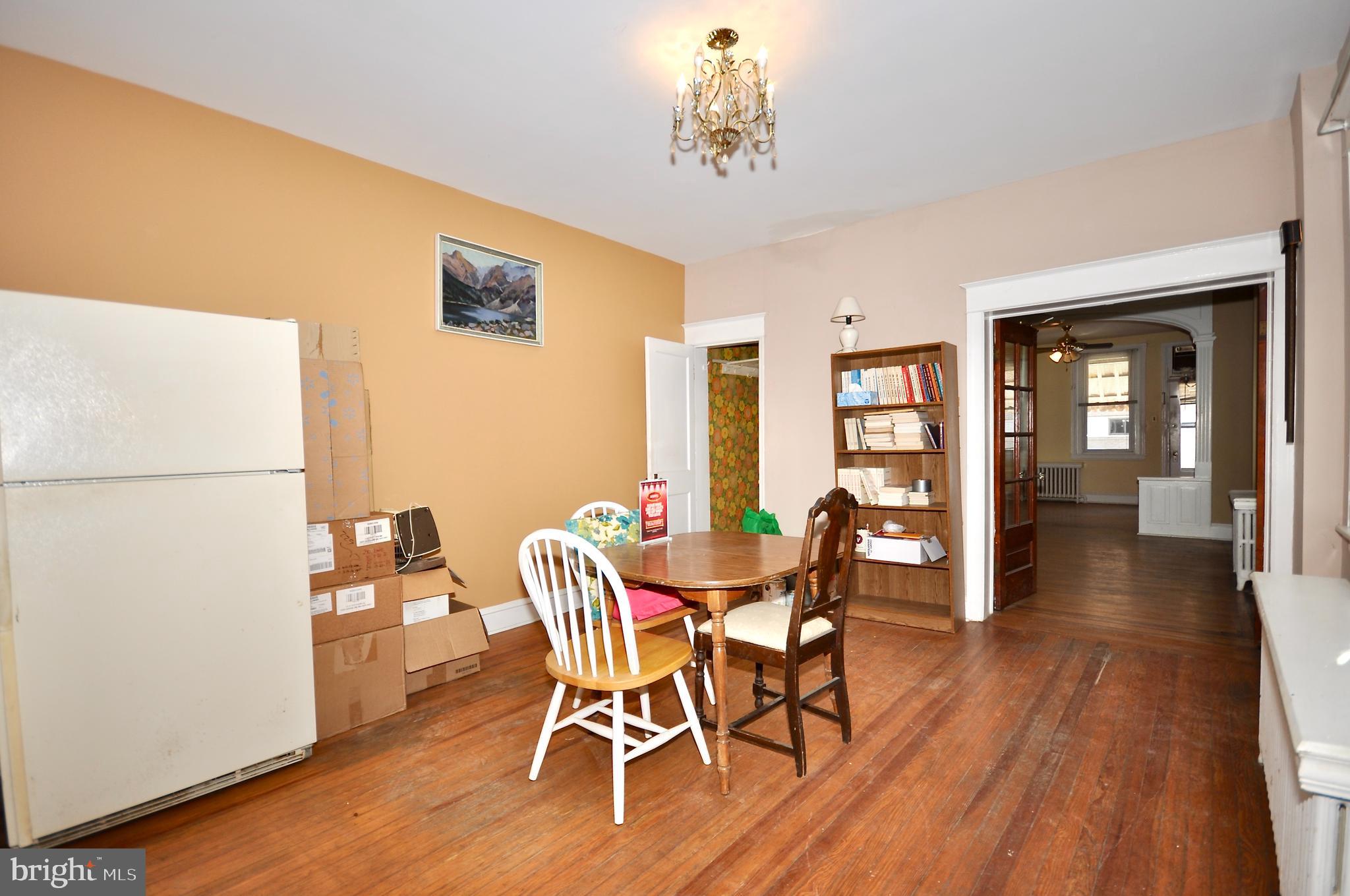 4566 Bermuda Street Philadelphia, PA 19124 - Photo 9 of 30 a view of a dining room with furniture and wooden floor