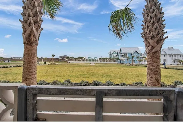 a view of a yard with an ocean view