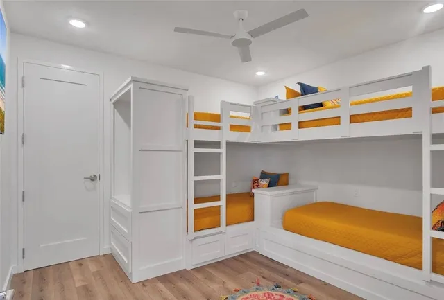 a view of a room with wooden floor and cabinet