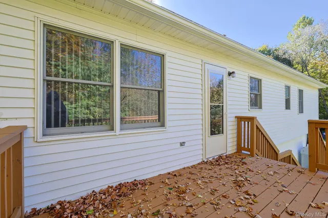 a view of a backyard with a large tree