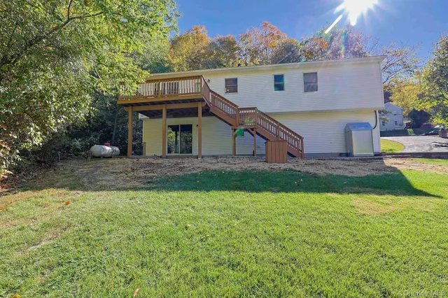 a front view of house with yard and green space