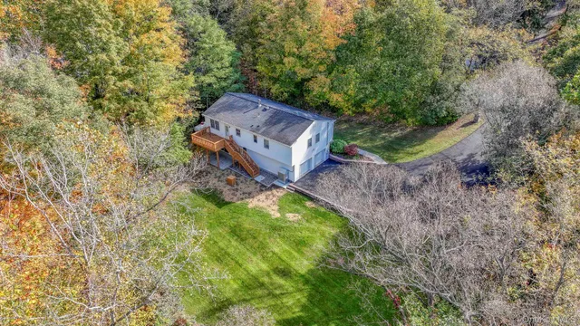 a backyard of a house with lots of green space