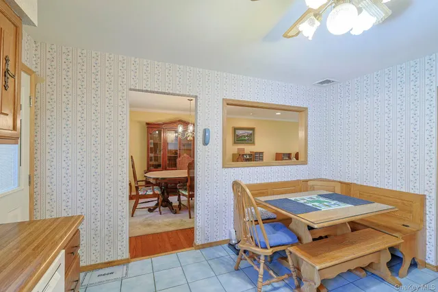 a living room with a table and chairs