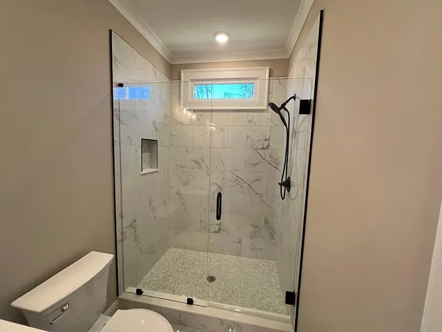 a bathroom with a bathtub and a shower