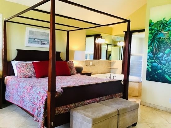 4439 Kaloloku Road, Unit B Kapaa, HI 96746 - Photo 13 of 18 a bedroom with a bed and a window