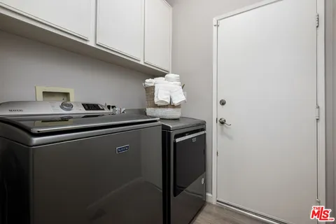a view of a swimming pool with chairs and a table