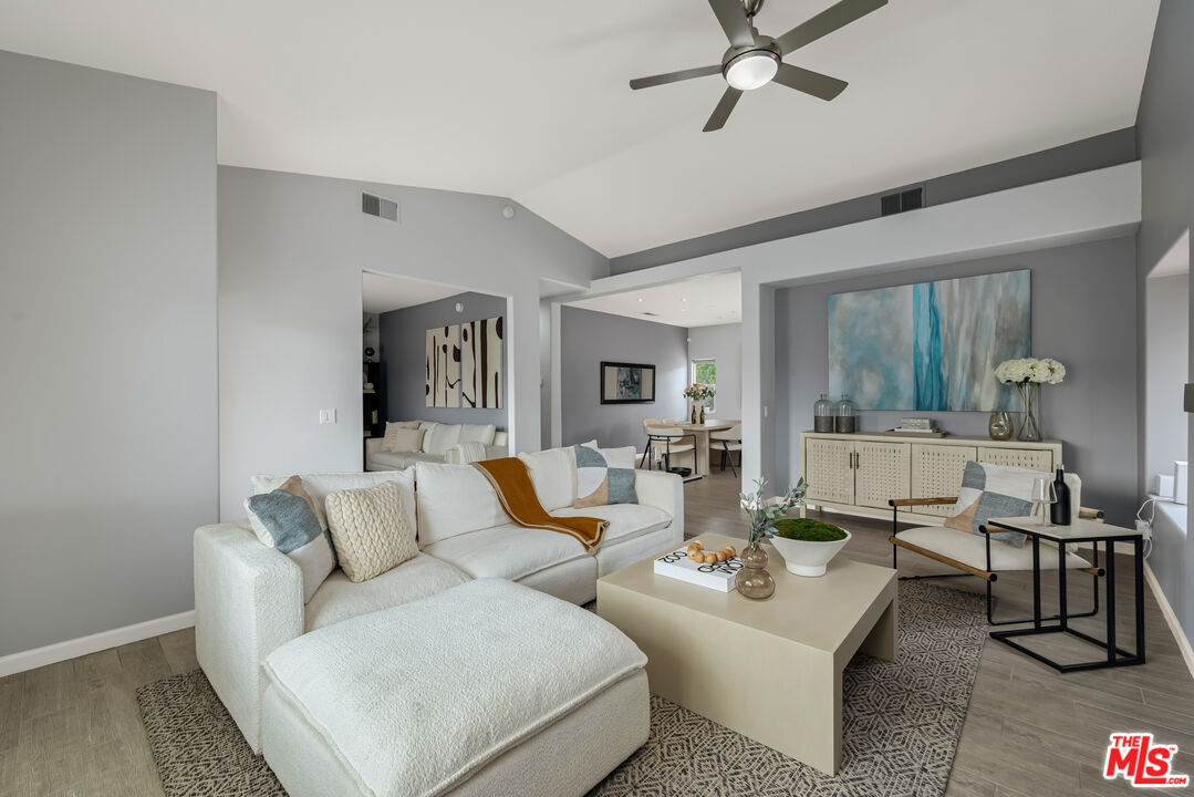 1602 Olga Way Palm Springs, CA 92262 - Photo 3 of 13 a living room with furniture and wooden floor