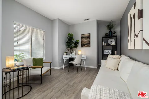 a spacious bedroom with a bed and a couch