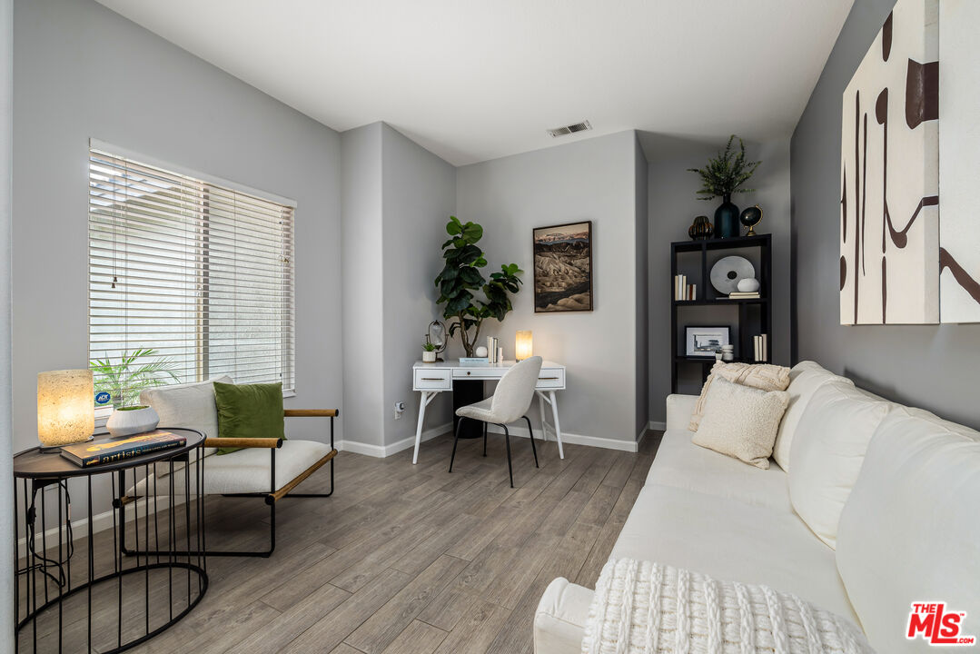 1602 Olga Way Palm Springs, CA 92262 - Photo 5 of 13 a living room with furniture and wooden floor