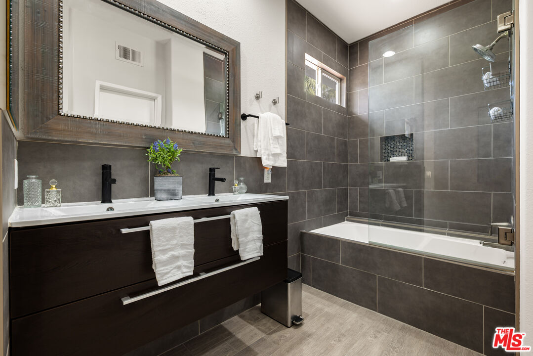 1602 Olga Way Palm Springs, CA 92262 - Photo 7 of 13 a bathroom with a sink and a mirror