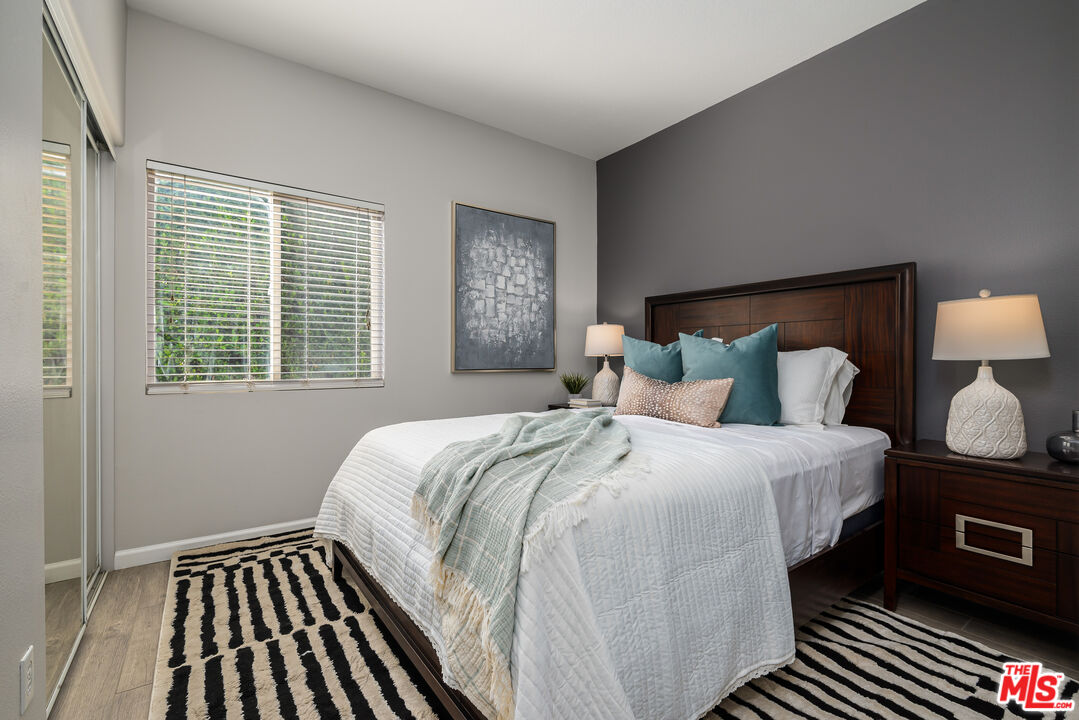 1602 Olga Way Palm Springs, CA 92262 - Photo 8 of 13 a bedroom with bed and window