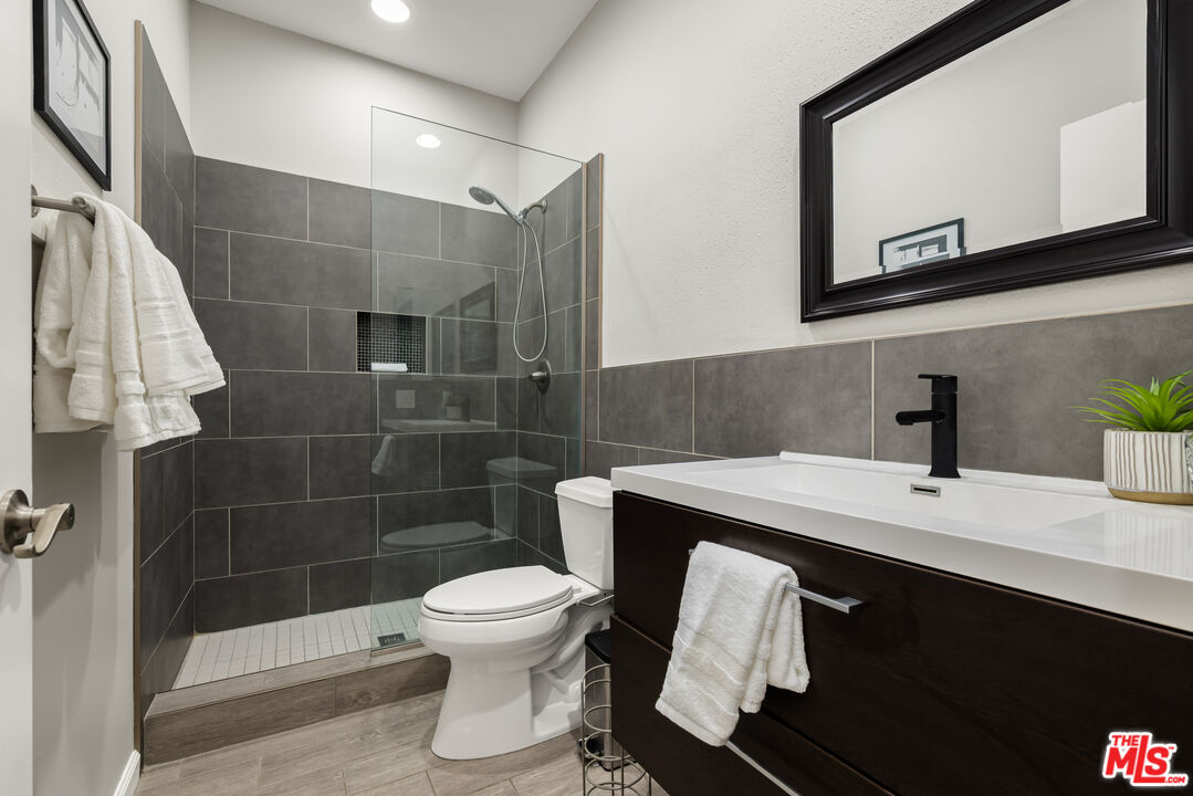 1602 Olga Way Palm Springs, CA 92262 - Photo 10 of 13 a bathroom with a sink toilet and shower