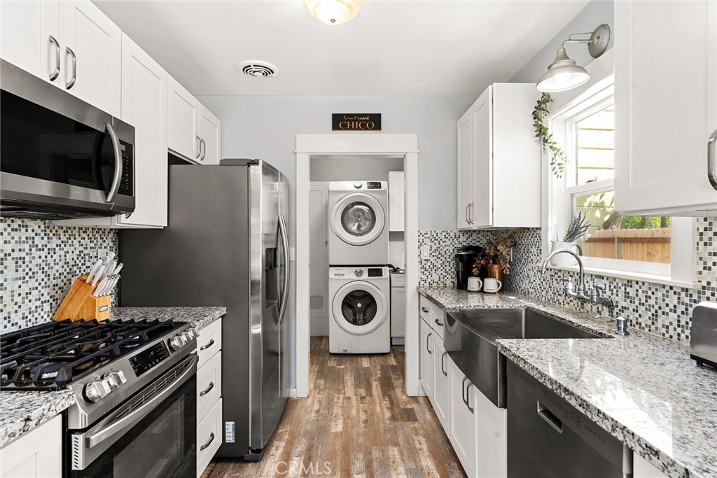 1151 Normal Avenue Chico, CA 95928 - Photo 14 of 32 a kitchen with stainless steel appliances granite countertop a stove a sink and a microwave