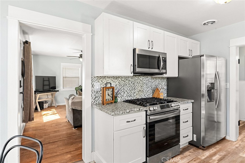 1151 Normal Avenue Chico, CA 95928 - Photo 15 of 32 a kitchen with stainless steel appliances a stove microwave and refrigerator