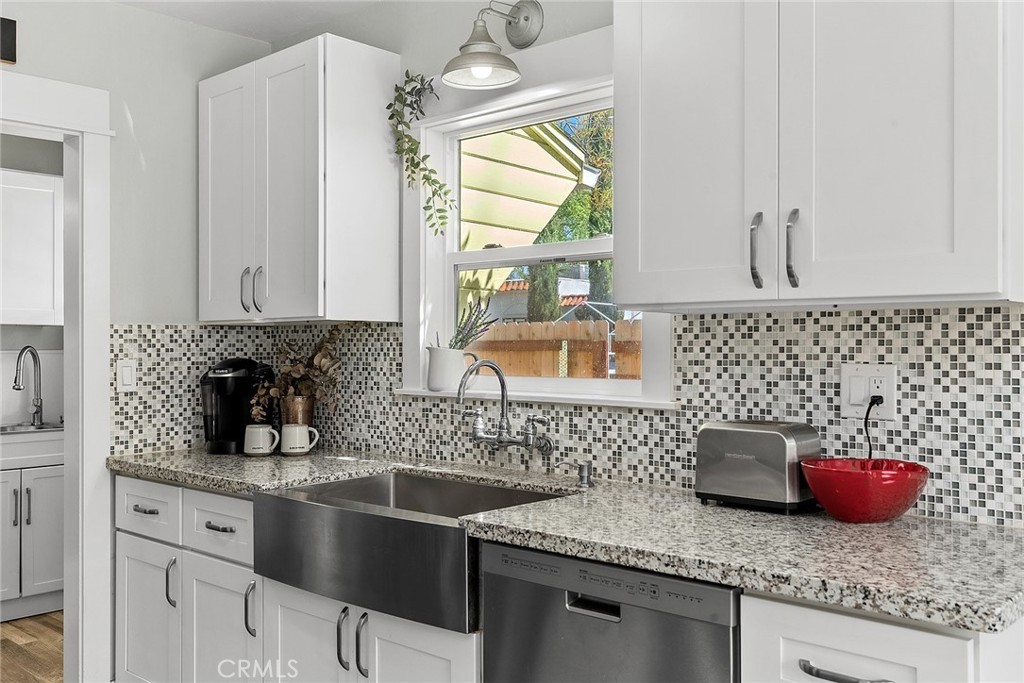 1151 Normal Avenue Chico, CA 95928 - Photo 3 of 32 a kitchen with stainless steel appliances granite countertop a sink stove and cabinets