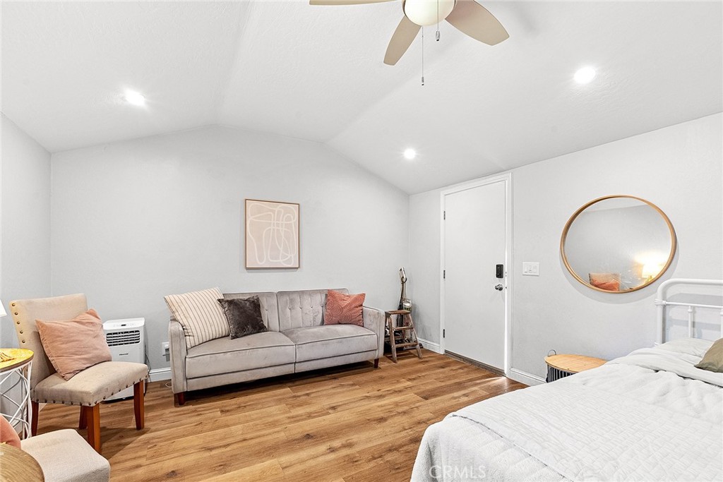 1151 Normal Avenue Chico, CA 95928 - Photo 5 of 32 a bedroom with a bed and chandelier