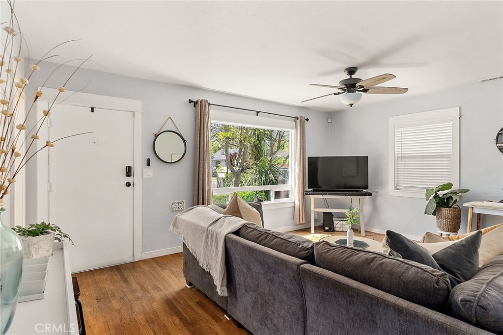 1151 Normal Avenue Chico, CA 95928 - Photo 9 of 32 a living room with furniture and a flat screen tv