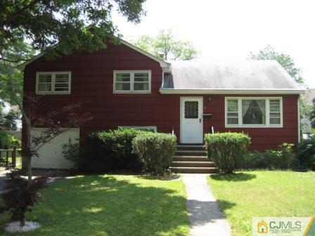 21 Daniel Road Spotswood, NJ 08884 - Photo 1 of 12 a front view of a house with garden