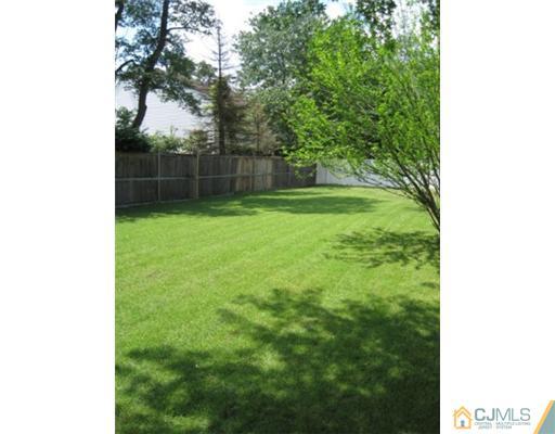 21 Daniel Road Spotswood, NJ 08884 - Photo 2 of 12 a view of a yard with a trees