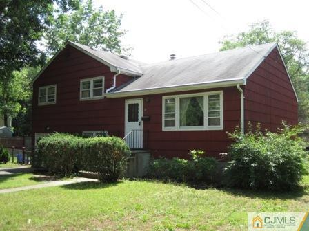 21 Daniel Road Spotswood, NJ 08884 - Photo 12 of 12 a view of a brick house with a yard and plants