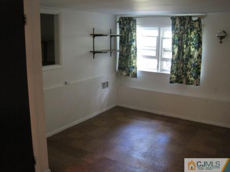 21 Daniel Road Spotswood, NJ 08884 - Photo 7 of 12 an empty room with a window