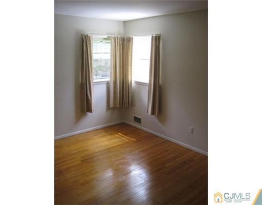 21 Daniel Road Spotswood, NJ 08884 - Photo 8 of 12 a view of an empty room and window