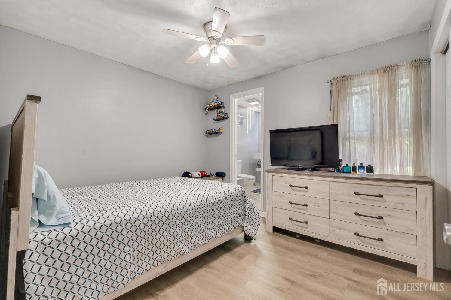 12 Pierrepont Avenue Middlesex, NJ 08846 - Photo 16 of 30 a bedroom with a bed and a flat screen tv