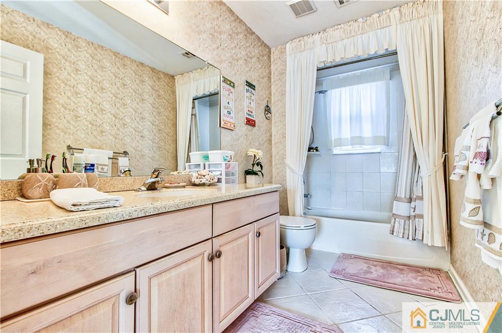 14 Mapleton Road Old Bridge, NJ 08857 - Photo 14 of 23 a bathroom with a sink toilet and shower