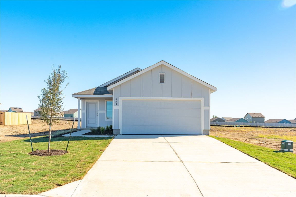 241 Kings Row Lane Jarrell, TX 76537 - Photo 1 of 27 a view of backyard of house with green space