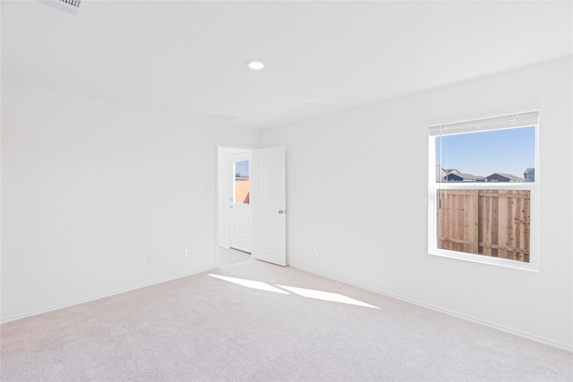 241 Kings Row Lane Jarrell, TX 76537 - Photo 12 of 27 an empty room with windows