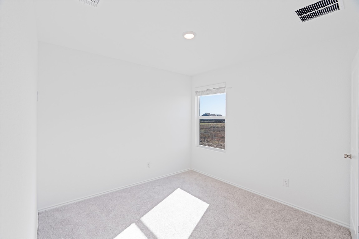 241 Kings Row Lane Jarrell, TX 76537 - Photo 17 of 27 an empty room with windows