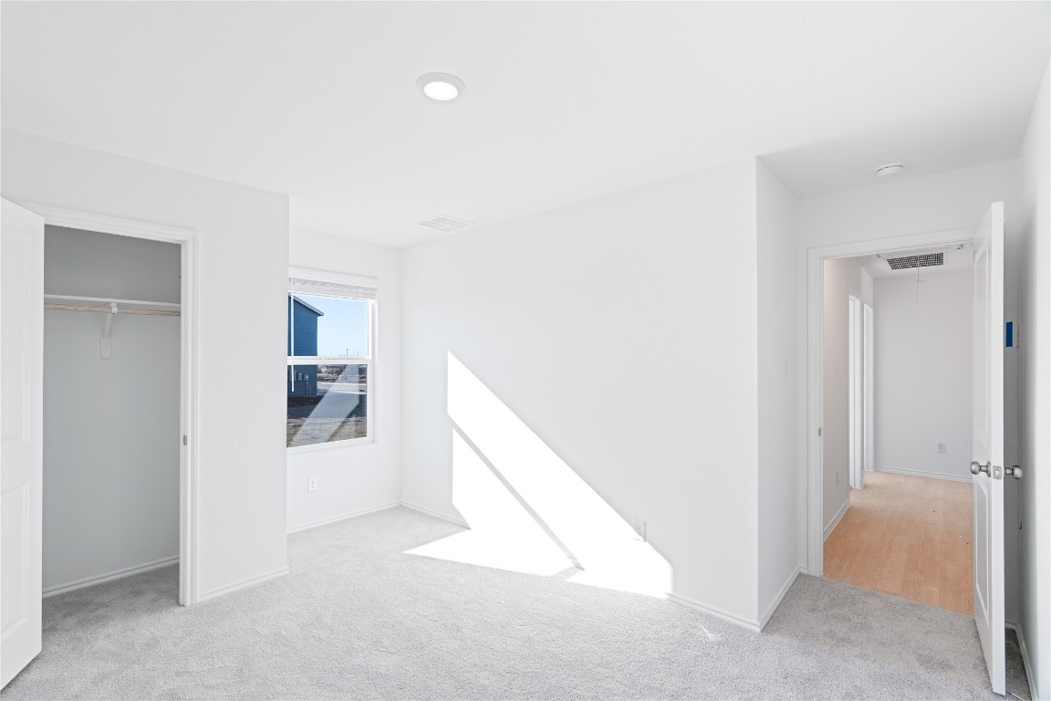 241 Kings Row Lane Jarrell, TX 76537 - Photo 20 of 27 a view of a hallway with wooden floor and entryway