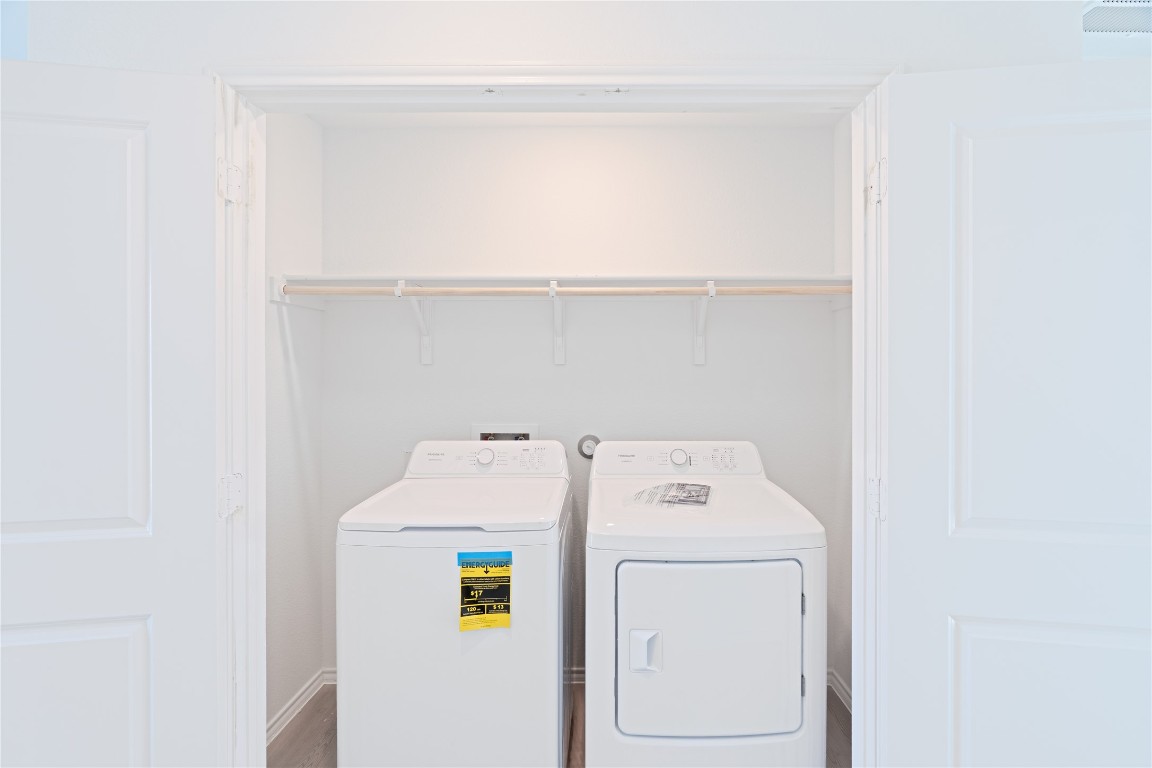 241 Kings Row Lane Jarrell, TX 76537 - Photo 23 of 27 a utility room with dryer and washer