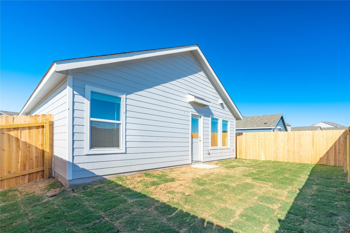 241 Kings Row Lane Jarrell, TX 76537 - Photo 25 of 27 a view of a backyard