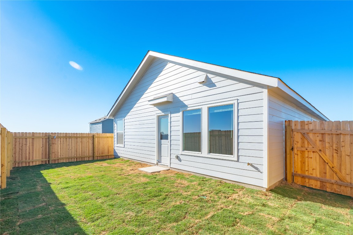 241 Kings Row Lane Jarrell, TX 76537 - Photo 26 of 27 a backyard of a house
