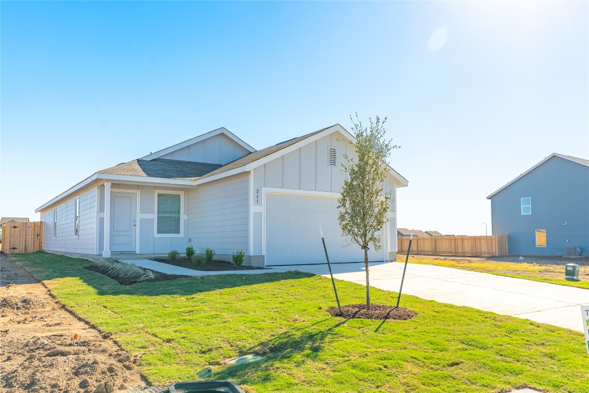 241 Kings Row Lane Jarrell, TX 76537 - Photo 3 of 27 a house view with swimming pool in front of it