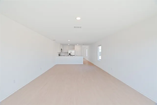 a view of a kitchen with a sink and a window