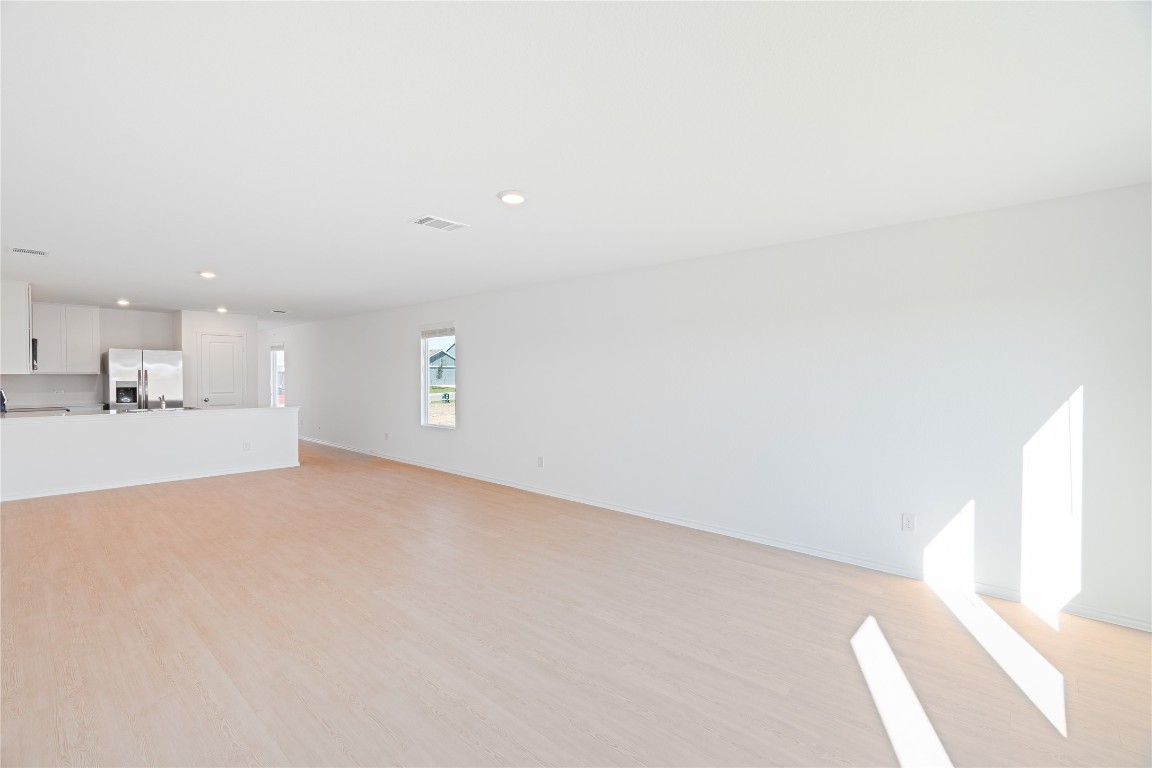 241 Kings Row Lane Jarrell, TX 76537 - Photo 7 of 27 a view of a kitchen with a sink and a window