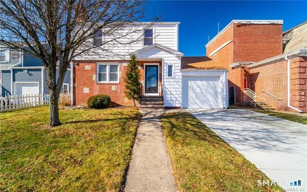 a front view of house with yard