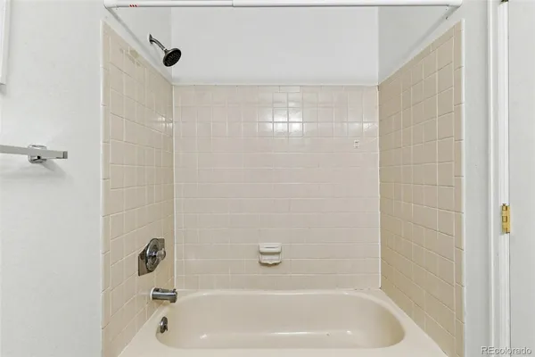 a close up of a bathtub curtain