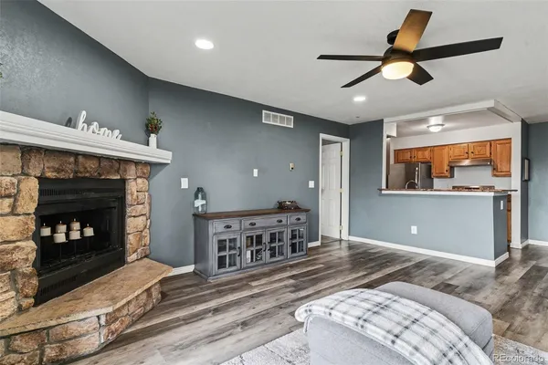 a bedroom with furniture and a fireplace