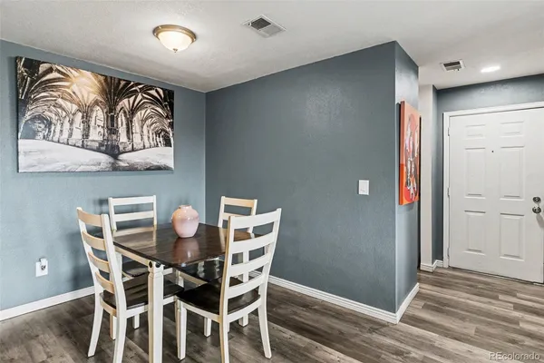 a view of a dining room with furniture