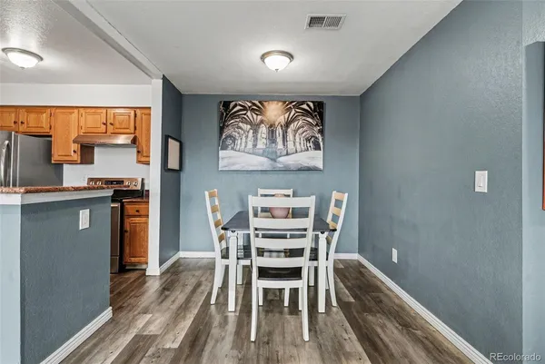 a dining room with furniture and window