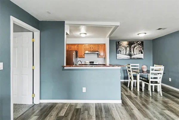 a view of a dining room with furniture window and wooden floor