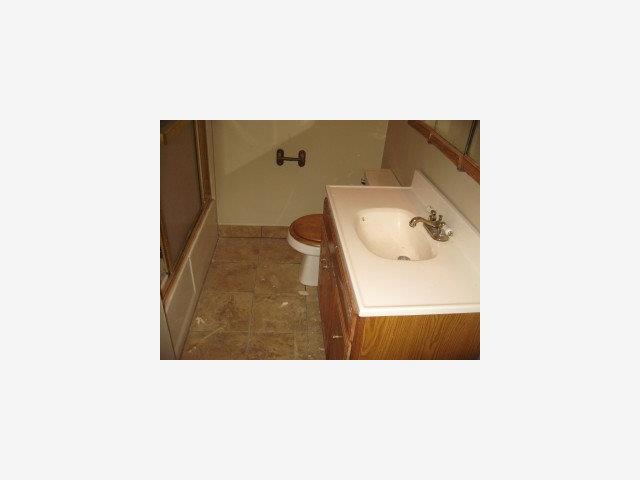 10687 West Larch Road Tracy, CA 95304 - Photo 5 of 5 a bathroom with a sink and mirror