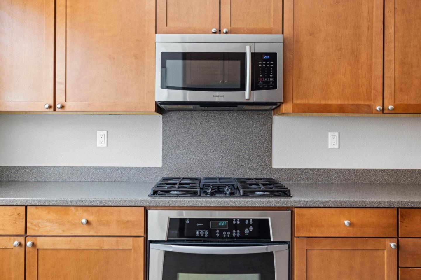 760 Mente Linda Loop Milpitas, CA 95035 - Photo 14 of 24 a kitchen with stainless steel appliances granite countertop a stove and a microwave