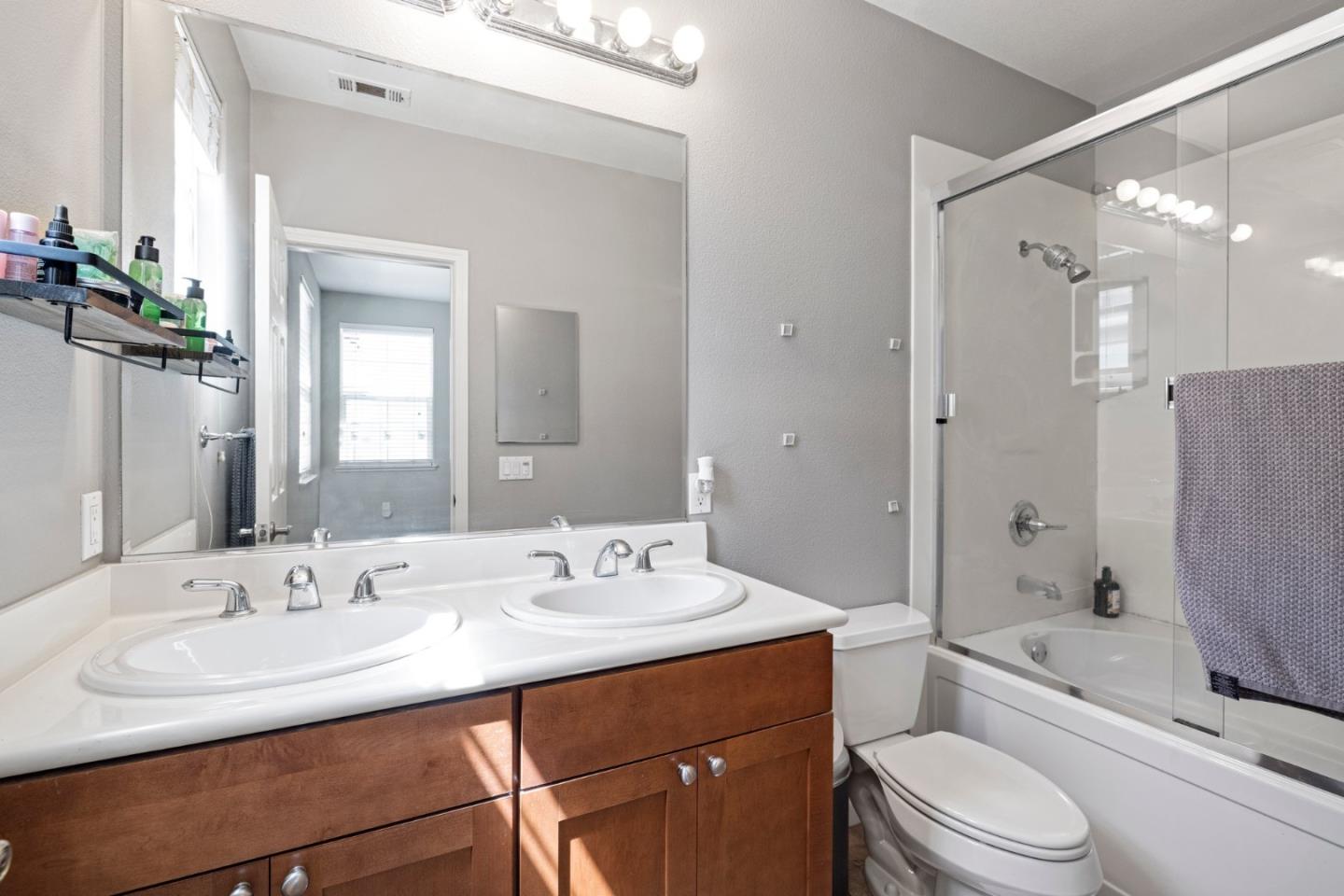760 Mente Linda Loop Milpitas, CA 95035 - Photo 16 of 24 a bathroom with a sink a toilet and shower