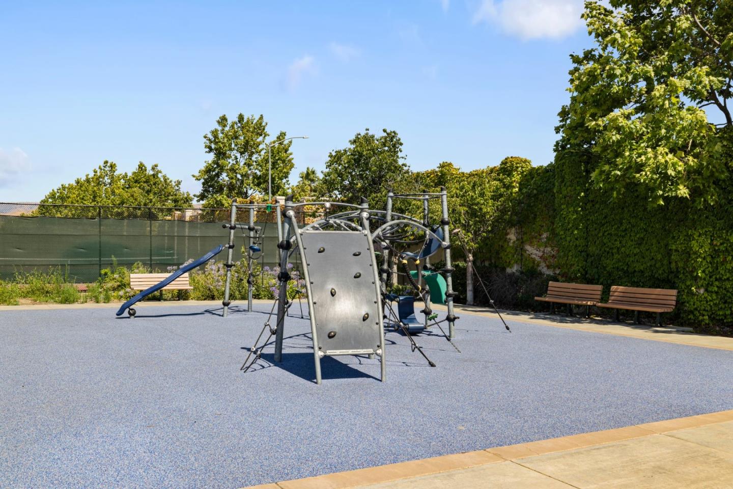 760 Mente Linda Loop Milpitas, CA 95035 - Photo 21 of 24 a view of a swimming pool with a bench and trees in the background