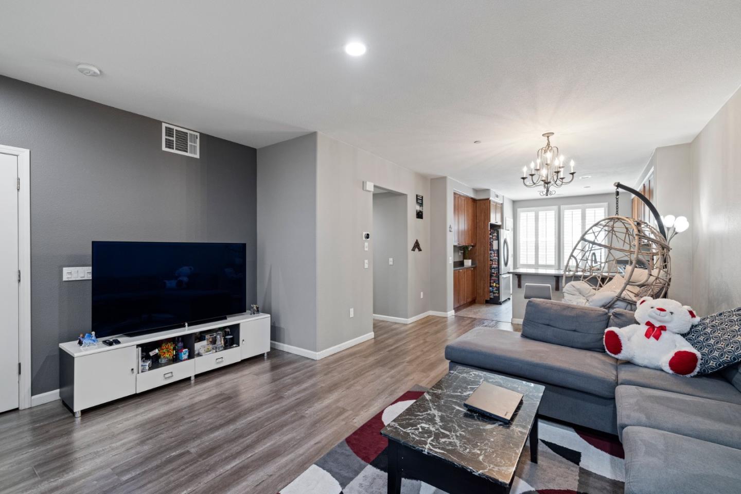 760 Mente Linda Loop Milpitas, CA 95035 - Photo 9 of 24 a living room with furniture and a flat screen tv